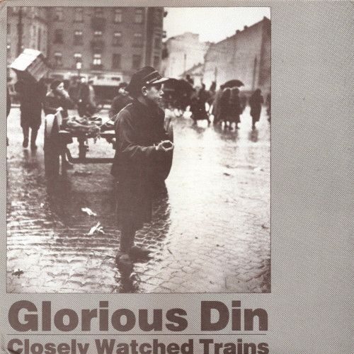 Cover. Minimal, grayish, and conveying a dark feeling. Has a photo of a boy standing on a public square looking to the side, with people behind