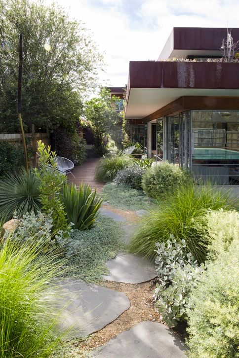 Garden view showing its integration with the house patio with a vary enticing chair in between